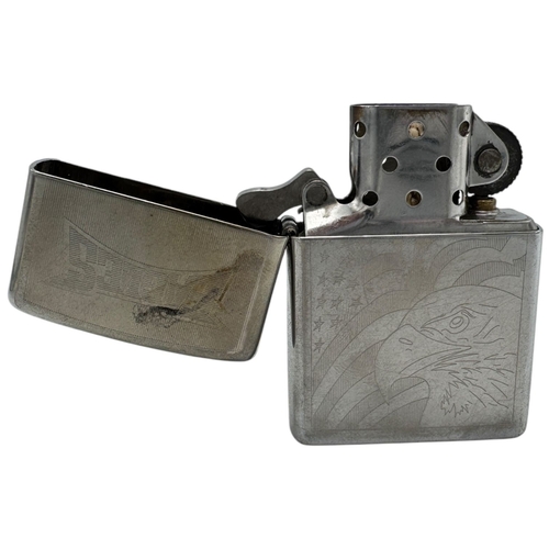 1733 - A vintage US Zippo Eagles Engraved Lighter. Some surface wear and patina consistent with age and use... 