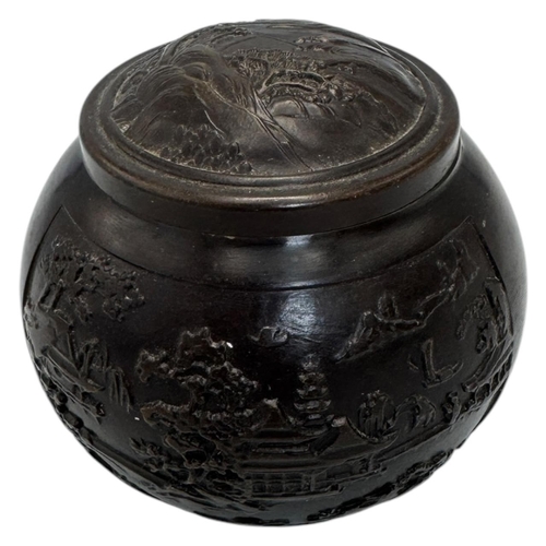 1702 - An antique Chinese Bronze Lidded Censer. Markings on base.
Bronze exterior with an intricate raised ... 