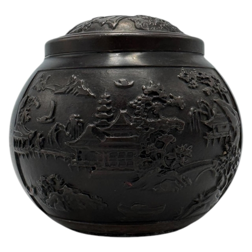 1702 - An antique Chinese Bronze Lidded Censer. Markings on base.
Bronze exterior with an intricate raised ... 