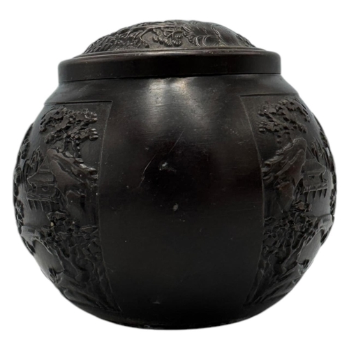 1702 - An antique Chinese Bronze Lidded Censer. Markings on base.
Bronze exterior with an intricate raised ... 