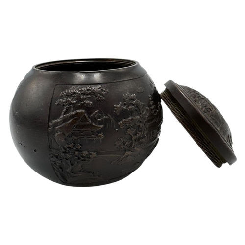 1702 - An antique Chinese Bronze Lidded Censer. Markings on base.
Bronze exterior with an intricate raised ... 