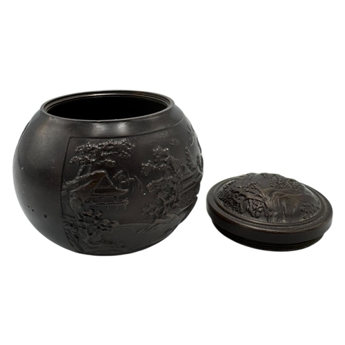 1702 - An antique Chinese Bronze Lidded Censer. Markings on base.
Bronze exterior with an intricate raised ... 