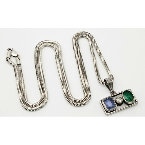 305 - A HERRINGBONE SILVER NECK CHAIN WITH A 3 STONE PENDANT .      36.5gms     80cms