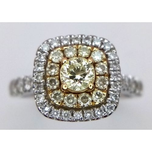 431 - AN 18K WHITE GOLD RING WITH WHITE AND CHAMPAGNE DIAMONDS .     4.3gms    size O