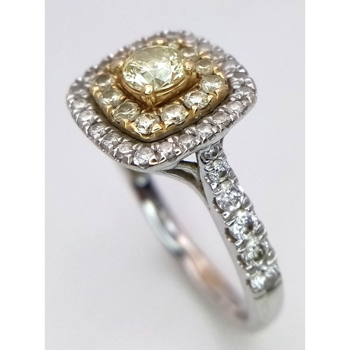 431 - AN 18K WHITE GOLD RING WITH WHITE AND CHAMPAGNE DIAMONDS .     4.3gms    size O