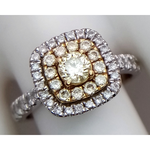 431 - AN 18K WHITE GOLD RING WITH WHITE AND CHAMPAGNE DIAMONDS .     4.3gms    size O