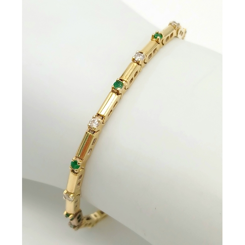 499 - A 14K GOLD BRACELET WITH DIAMONDS AND EMERALDS .    10gms     18cms