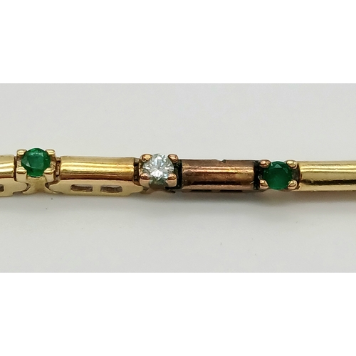 499 - A 14K GOLD BRACELET WITH DIAMONDS AND EMERALDS .    10gms     18cms