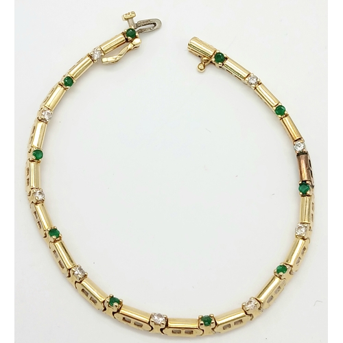 499 - A 14K GOLD BRACELET WITH DIAMONDS AND EMERALDS .    10gms     18cms