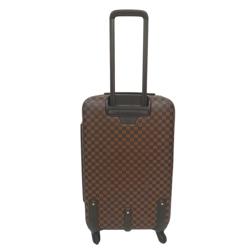 150 - A Louis Vuitton Damier Ebene Canvas Zephyr 70 Rolling Suitcase. Brown and tan monogram coated canvas... 