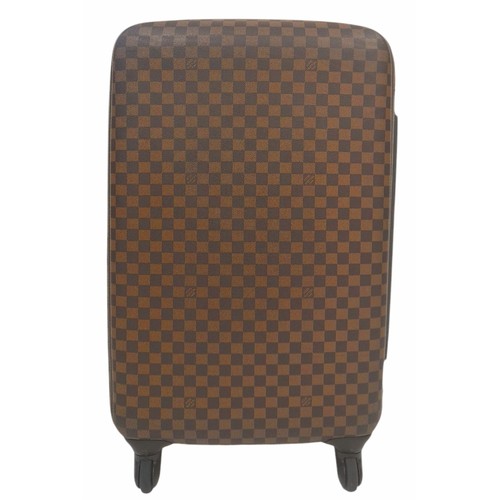 150 - A Louis Vuitton Damier Ebene Canvas Zephyr 70 Rolling Suitcase. Brown and tan monogram coated canvas... 