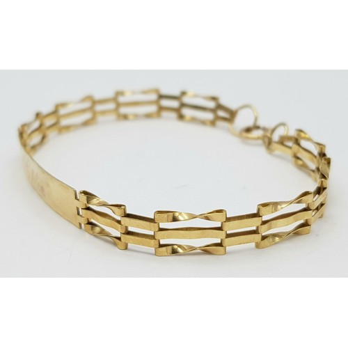 233 - A 9K Yellow Gold Identity Bracelet with Gate Links. 16cm. 3.3g