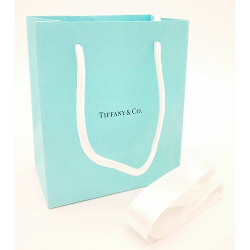 157 - A TIFFANY 950 PLATINUM BAND RING IN THE ORIGINAL TIFFANY RING BOX AND PACKAGING.   4.8gms    size N