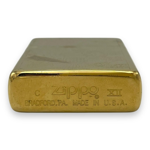 1401 - A vintage US Zippo Gold-Tone Engraved USA Emblem Lighter.
Approximately 5.5cm height x 3.5cm width. ... 