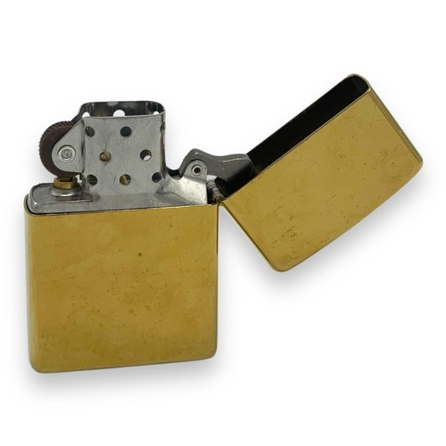 1401 - A vintage US Zippo Gold-Tone Engraved USA Emblem Lighter.
Approximately 5.5cm height x 3.5cm width. ... 