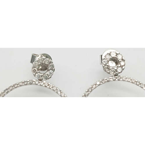 171 - A STUNNING PAIR OF 14K WHITE GOLD DIAMOND HOOP EARRINGS.   4.2gms