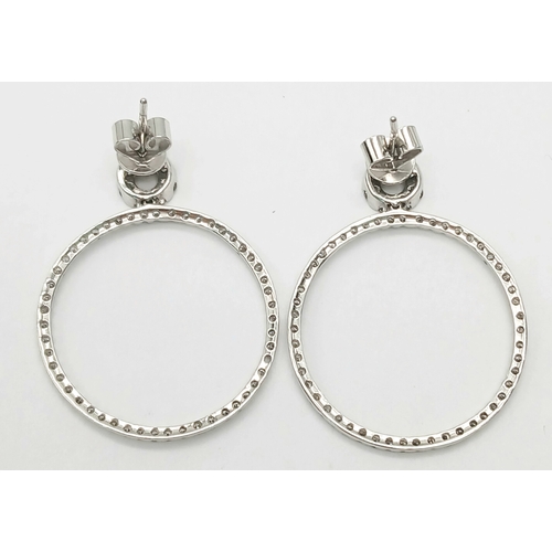 171 - A STUNNING PAIR OF 14K WHITE GOLD DIAMOND HOOP EARRINGS.   4.2gms