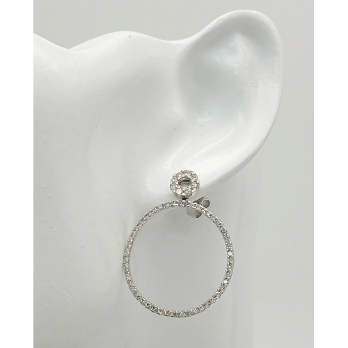 171 - A STUNNING PAIR OF 14K WHITE GOLD DIAMOND HOOP EARRINGS.   4.2gms