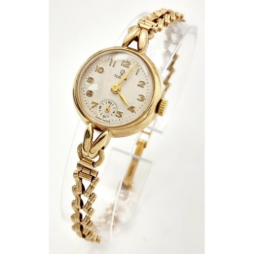 215 - A Vintage 9K Yellow Gold Tudor Ladies Watch. 9K gold bracelet and case - 22mm. White dial with sub d... 