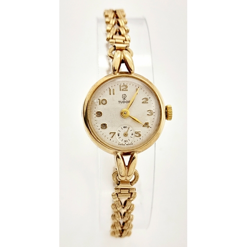 215 - A Vintage 9K Yellow Gold Tudor Ladies Watch. 9K gold bracelet and case - 22mm. White dial with sub d... 