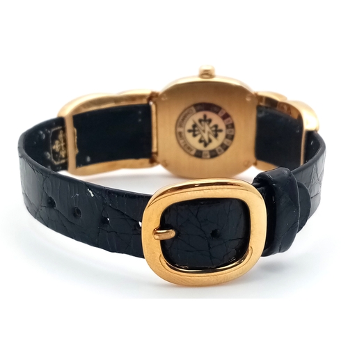 65 - A  Patek Phillipe 18K Gold Cased and Buckle  Ladies Watch.  18K Gold elegant case - 24mm.