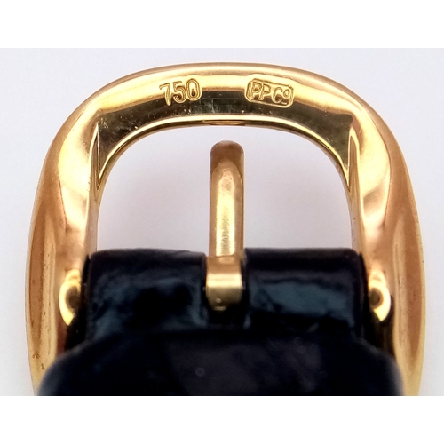 65 - A  Patek Phillipe 18K Gold Cased and Buckle  Ladies Watch.  18K Gold elegant case - 24mm.