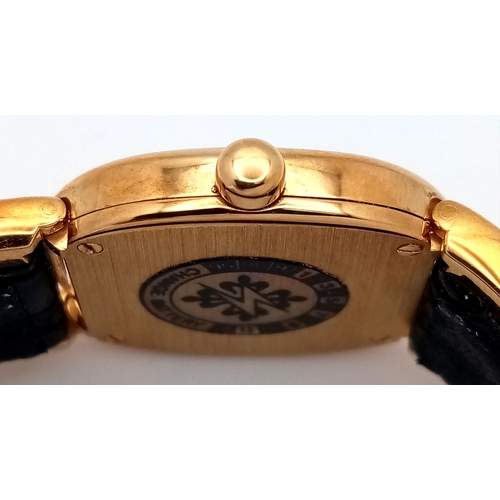 65 - A  Patek Phillipe 18K Gold Cased and Buckle  Ladies Watch.  18K Gold elegant case - 24mm.