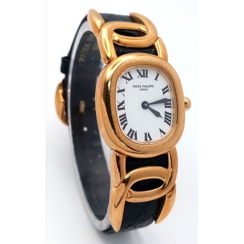 65 - A  Patek Phillipe 18K Gold Cased and Buckle  Ladies Watch.  18K Gold elegant case - 24mm.