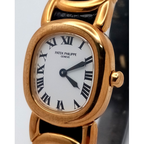 65 - A  Patek Phillipe 18K Gold Cased and Buckle  Ladies Watch.  18K Gold elegant case - 24mm.