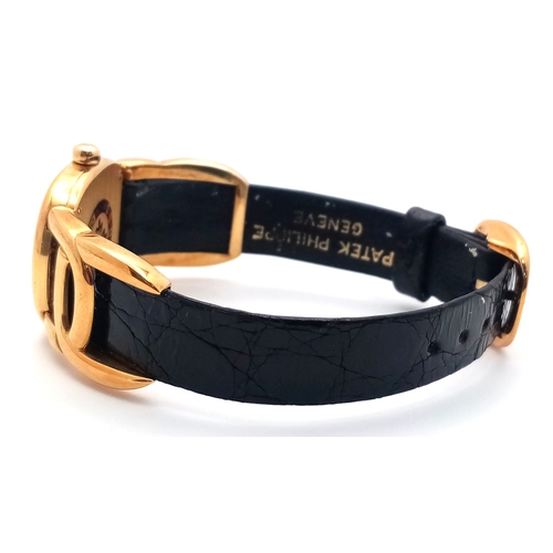 65 - A  Patek Phillipe 18K Gold Cased and Buckle  Ladies Watch.  18K Gold elegant case - 24mm.