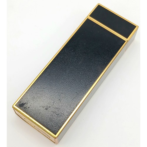 144 - A Vintage Cartier Pentagon Black Lacquer Lighter. 7cm. In working order. UK mainland sales only.