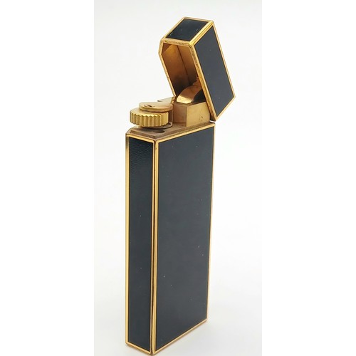 144 - A Vintage Cartier Pentagon Black Lacquer Lighter. 7cm. In working order. UK mainland sales only.