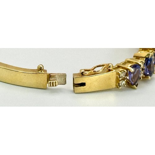 243 - A 14K GOLD HINGED DIAMONDS AND STONE SET BANGLE  .    25.4gms