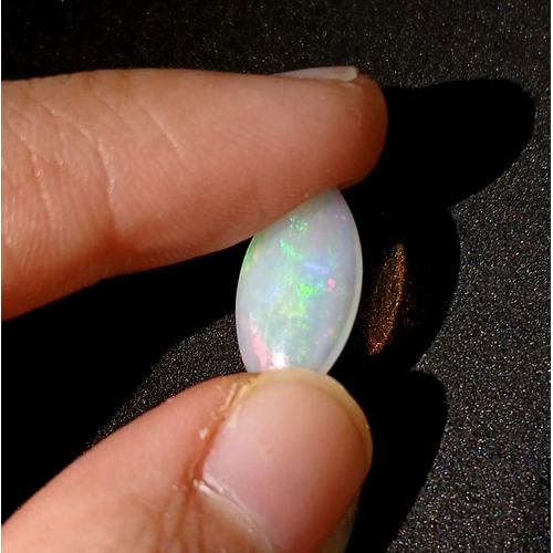 1174 - A 2.12ct Natural White Ethiopian Colourplay Opal Gemstone. Marquise shape, Cabochon cut. Comes with ... 