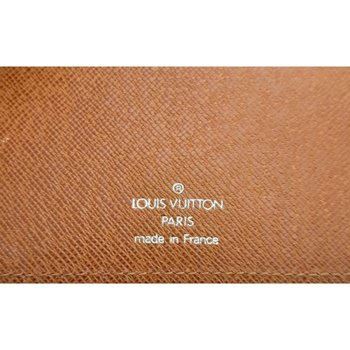 1704 - A Louis Vuitton Brown Epi Leather Organiser. 14 x 18cm