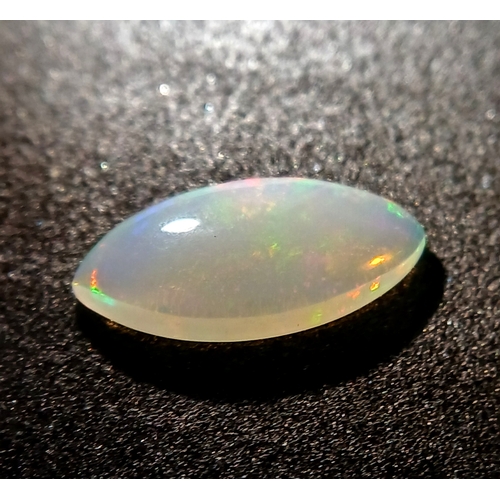 1174 - A 2.12ct Natural White Ethiopian Colourplay Opal Gemstone. Marquise shape, Cabochon cut. Comes with ... 