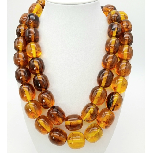 1478 - A Champagne Coloured Large Resin Bead Necklace. 2.5cm beads. 104cm.