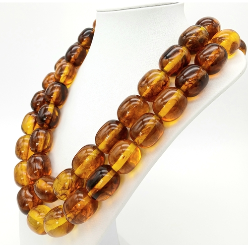 1478 - A Champagne Coloured Large Resin Bead Necklace. 2.5cm beads. 104cm.