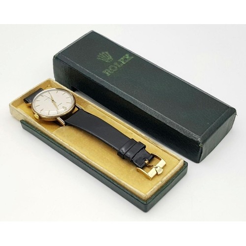 54 - A Vintage 1957 Rolex Precision 9K Gold Cased Gents Watch. Hand wind movement. Black leather strap wi... 