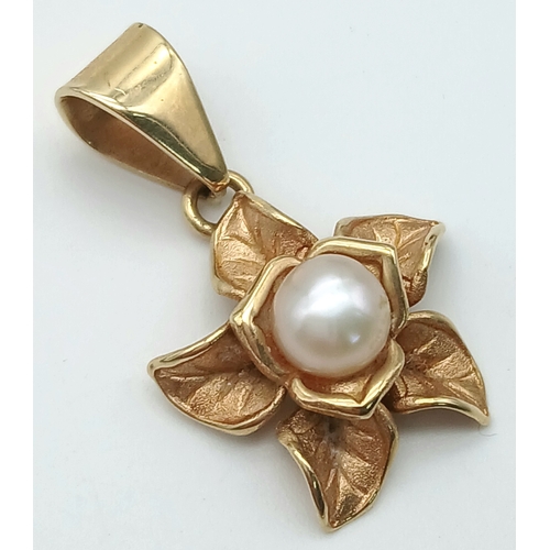 111 - A 14K Yellow Gold and Pearl Floral Form Pendant. 3cm. 2.8g