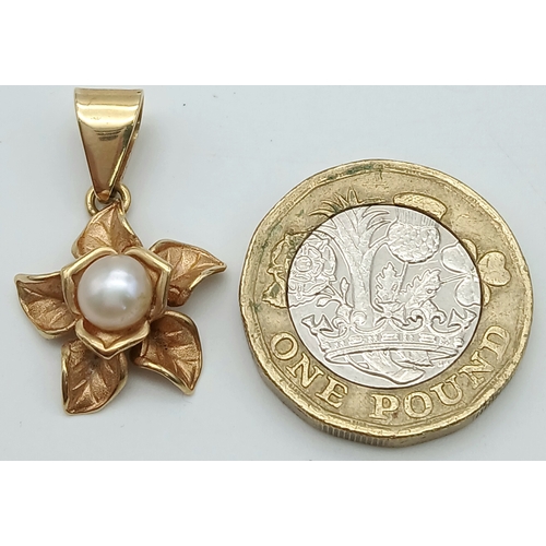 111 - A 14K Yellow Gold and Pearl Floral Form Pendant. 3cm. 2.8g