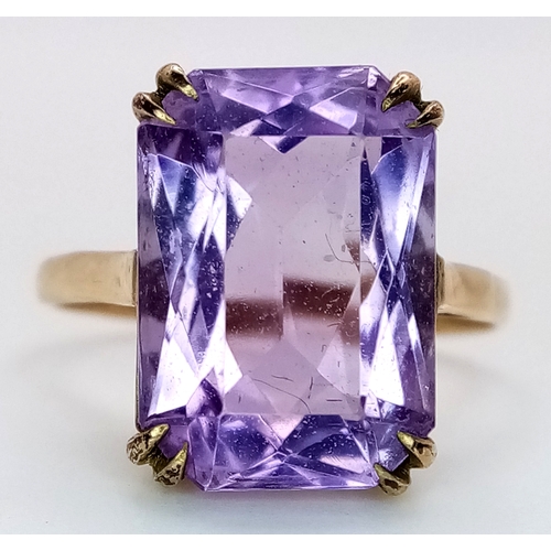 1135 - A Vintage 9K Yellow Gold Amethyst Ring. A 5ct emerald cut. Size O. 3.6g