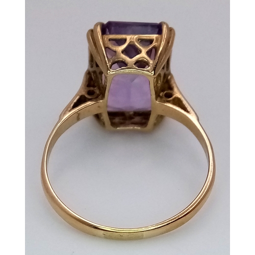 1135 - A Vintage 9K Yellow Gold Amethyst Ring. A 5ct emerald cut. Size O. 3.6g