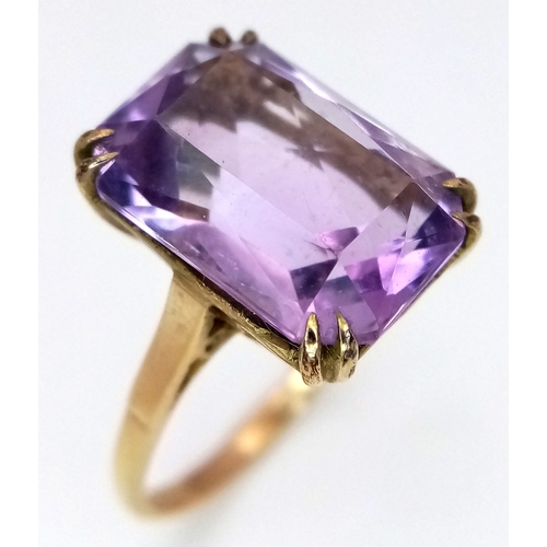 1135 - A Vintage 9K Yellow Gold Amethyst Ring. A 5ct emerald cut. Size O. 3.6g