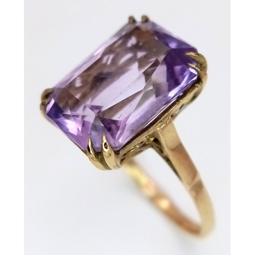 1135 - A Vintage 9K Yellow Gold Amethyst Ring. A 5ct emerald cut. Size O. 3.6g