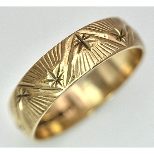 132 - A 9K Yellow Gold Decorative Band Ring. 6mm width. Size L 1/2. 2.38g. Full UK hallmarks.