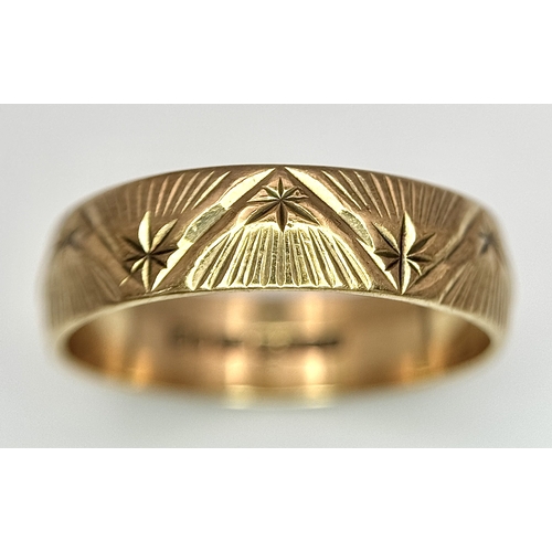 132 - A 9K Yellow Gold Decorative Band Ring. 6mm width. Size L 1/2. 2.38g. Full UK hallmarks.