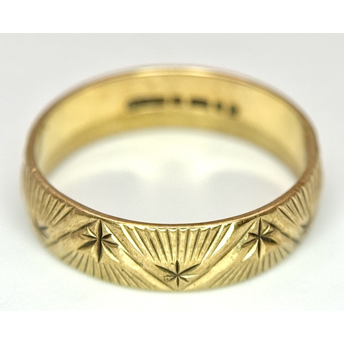 132 - A 9K Yellow Gold Decorative Band Ring. 6mm width. Size L 1/2. 2.38g. Full UK hallmarks.