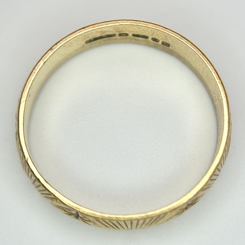 132 - A 9K Yellow Gold Decorative Band Ring. 6mm width. Size L 1/2. 2.38g. Full UK hallmarks.