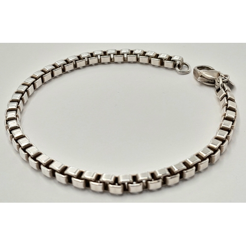 146 - A Sterling Silver Venetian Link Tiffany Bracelet. 16cm. 15.7g